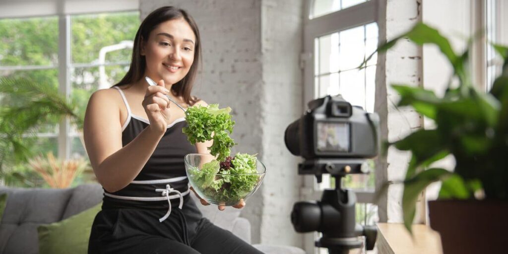 A female vlogger shooting a diet YouTube video