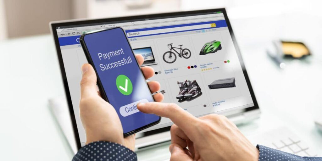 A Person making a payment on their mobile phone