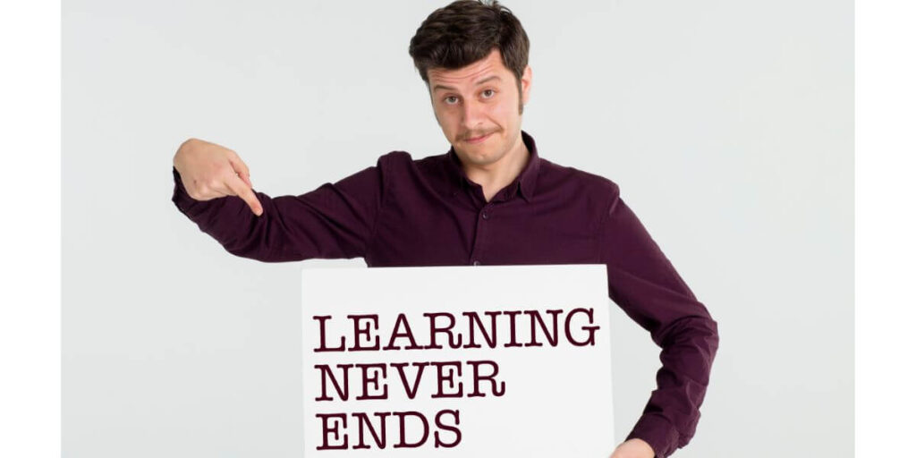 Man with sign about education and learning