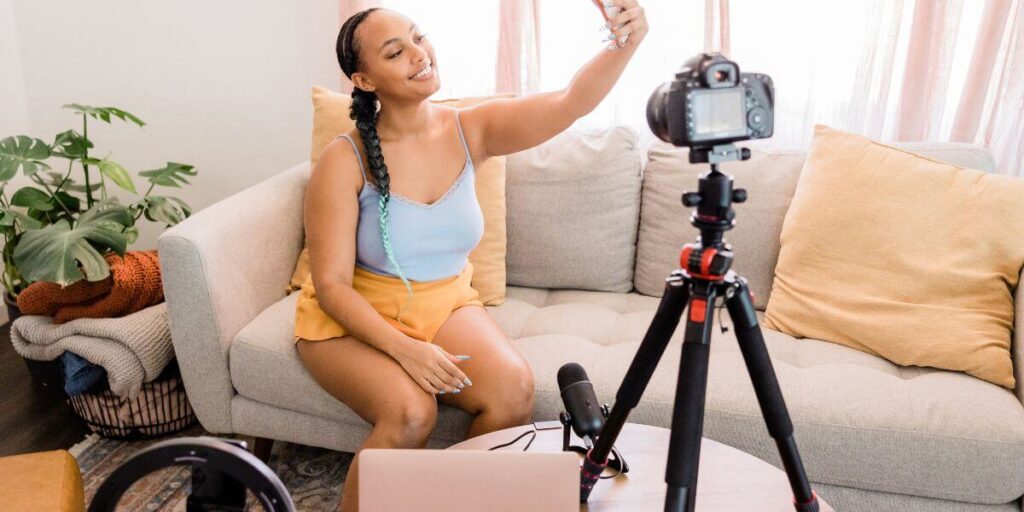 Lady using a wireless microphone to film