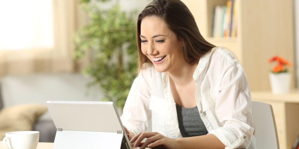 A happy woman blogger optimizing her content for SEO