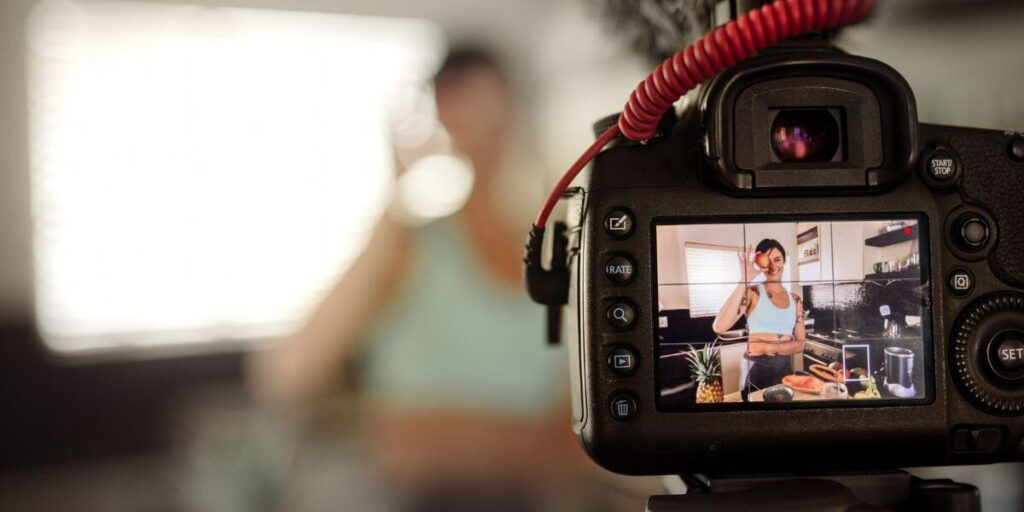 Young woman making YouTube vlog about healthy food